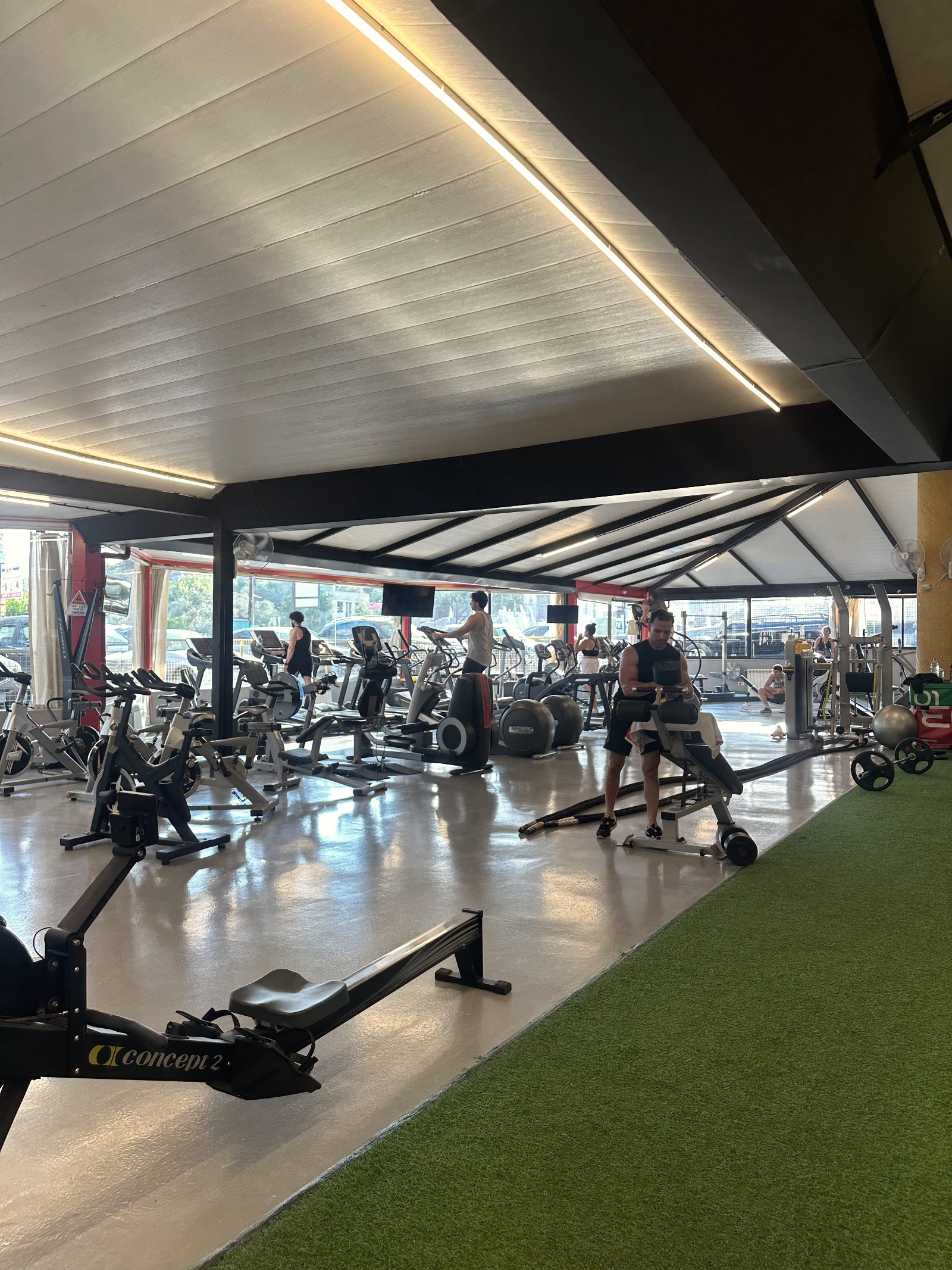 Row of cardio machines by the windows at North Fitness